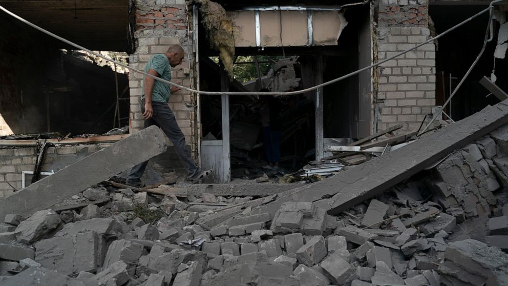 A man walks over debris of a psychiatric hospital that was heavily damaged after a Russian attack in Kramatorsk, Ukraine, Wednesday, Sept. 7, 2022. (AP Photo/Leo Correa)